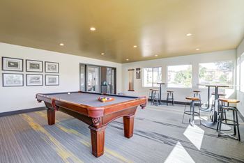 Community Clubhouse billiards table and game room area at Addison Ranch Apartments, Petaluma, California